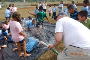 Doug keeping the slip and slide sheet and everyone wet!