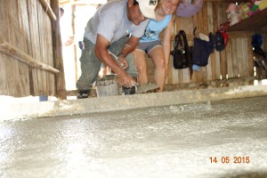 Fran smoothing the concrete