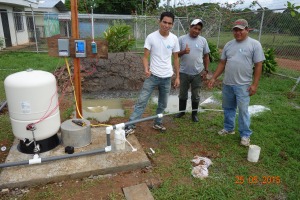 Left to Right, Omar, Frank and Chente  with the operating well.