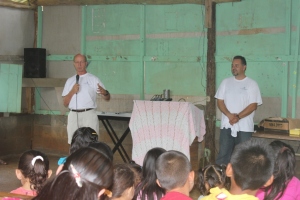 Dale Perkins on the left giving a sermon. 